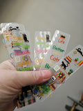 Bookshelf Bookmarks with black cats in hand
