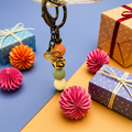 Introducing our stunning handmade gold bow charm keychain with colorful beads, a delightful accessory 